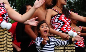 a girl performing a Maori dance